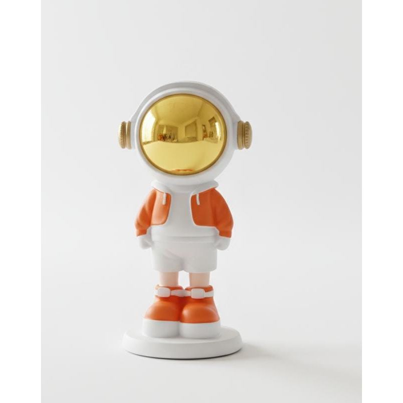 AKDC 16cm Ceramic Small Astronaut Standing Décor in White with Orange | Artistic Decorative Mini Astronaut Sculpture - Al Kabayel Discount CentreAKDC 16cm Ceramic Small Astronaut Standing Décor in White with Orange | Artistic Decorative Mini Astronaut SculptureHome Décor AccentsAKDCAl Kabayel Discount Centre