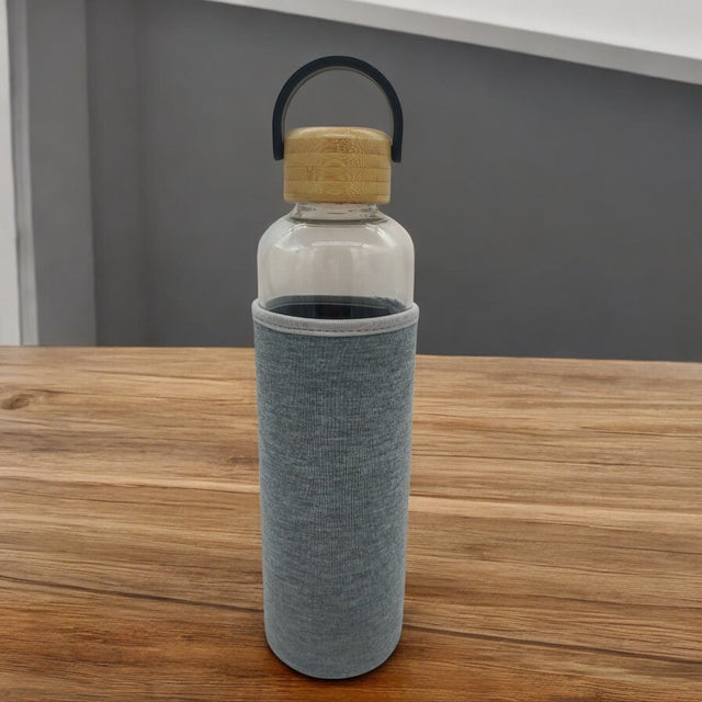 AKDC Glass bottle with wooden lid carry 900ml High Glass Water Bottle, With Wooden Lid with sleeve, Suitable For Outdoor Sports, Fitness, Travel. - Al Kabayel Discount CentreAKDC Glass bottle with wooden lid carry 900ml High Glass Water Bottle, With Wooden Lid with sleeve, Suitable For Outdoor Sports, Fitness, Travel.Water BottlesAKDCAl Kabayel Discount Centre