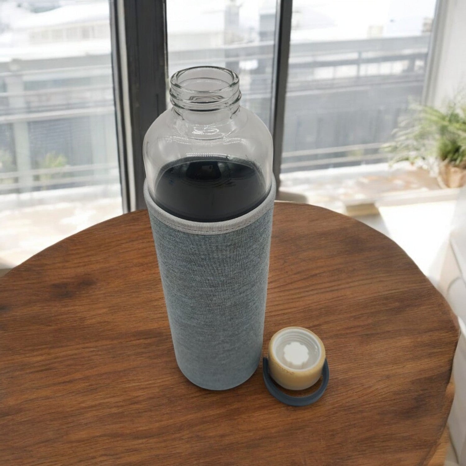 AKDC Glass bottle with wooden lid carry 900ml High Glass Water Bottle, With Wooden Lid with sleeve, Suitable For Outdoor Sports, Fitness, Travel. - Al Kabayel Discount CentreAKDC Glass bottle with wooden lid carry 900ml High Glass Water Bottle, With Wooden Lid with sleeve, Suitable For Outdoor Sports, Fitness, Travel.Water BottlesAKDCAl Kabayel Discount Centre