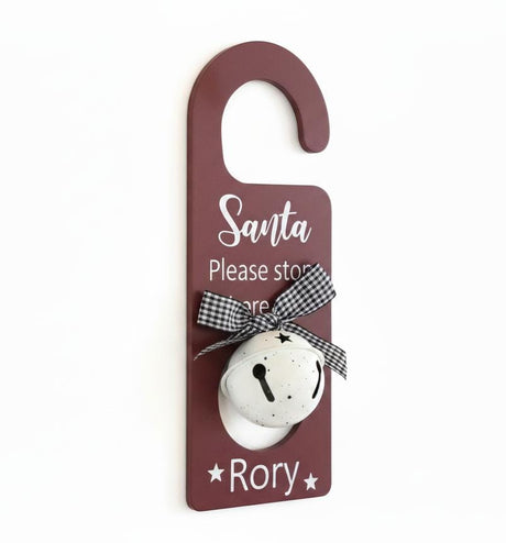 AKDC Red “Santa Please Stop Here for Rory” Hanging Décor with Bell – Festive Christmas Wall Sign & Door Ornament - Al Kabayel Discount CentreAKDC Red “Santa Please Stop Here for Rory” Hanging Décor with Bell – Festive Christmas Wall Sign & Door OrnamentHome Décor AccentsAKDCAl Kabayel Discount Centre