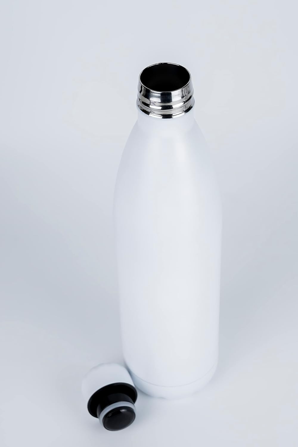 Nessan Sport Water Bottle Vacuum Insulated Stainless Steel Sport Water Bottle Leak - Proof Double Wall Cola Shape Water Bottle, Keep Drinks Hot & Cold - 750ML - White - Al Kabayel Discount CentreNessan Sport Water Bottle Vacuum Insulated Stainless Steel Sport Water Bottle Leak - Proof Double Wall Cola Shape Water Bottle, Keep Drinks Hot & Cold - 750ML - WhiteWater BottlesNESSANAl Kabayel Discount Centre