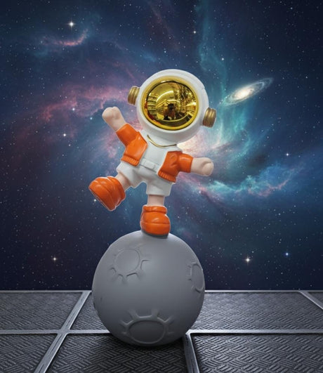 AKDC 24cm Ceramic Astronaut Balancing on Moon Décor in Orange and White | Unique Space Art Sculpture for Home - Al Kabayel Discount CentreAKDC 24cm Ceramic Astronaut Balancing on Moon Décor in Orange and White | Unique Space Art Sculpture for HomeHome Décor AccentsAKDCAl Kabayel Discount Centre