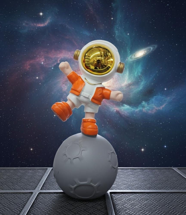 AKDC 24cm Ceramic Astronaut Balancing on Moon Décor in Orange and White | Unique Space Art Sculpture for Home - Al Kabayel Discount CentreAKDC 24cm Ceramic Astronaut Balancing on Moon Décor in Orange and White | Unique Space Art Sculpture for HomeHome Décor AccentsAKDCAl Kabayel Discount Centre