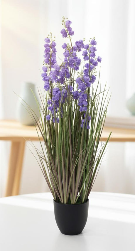 AKDC Artificial Grass with Lavender Flowers - Potted in Plastic Pot, Fragrant - Looking Blooms for Endless Beauty, 80 cm," - Combines plastic grass with lavender - hued flowers, evoking a fragrant field without the pollen. - Al Kabayel Discount CentreAKDC Artificial Grass with Lavender Flowers - Potted in Plastic Pot, Fragrant - Looking Blooms for Endless Beauty, 80 cm," - Combines plastic grass with lavender - hued flowers, evoking a fragrant field without the pollen.Artificial FloraAKDCAl Kaba