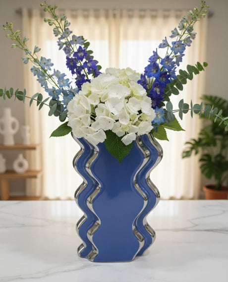AKDC Blue & Silver Decorative Flower Vase 19cm – Elegant Ceramic - Style Plastic Vase for Artificial or Fresh Flowers, Ideal for Home & Office Decor - Al Kabayel Discount CentreAKDC Blue & Silver Decorative Flower Vase 19cm – Elegant Ceramic - Style Plastic Vase for Artificial or Fresh Flowers, Ideal for Home & Office DecorFlower/Plant PotsAKDCAl Kabayel Discount Centre