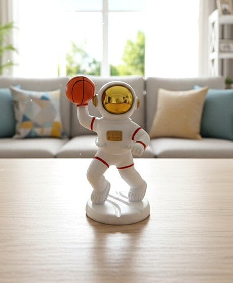 AKDC Ceramic Astronaut Holding Basketball Figurine – White & Orange Sports Space Theme Décor 14 cm - Al Kabayel Discount CentreAKDC Ceramic Astronaut Holding Basketball Figurine – White & Orange Sports Space Theme Décor 14 cmHome Décor AccentsAKDCAl Kabayel Discount Centre