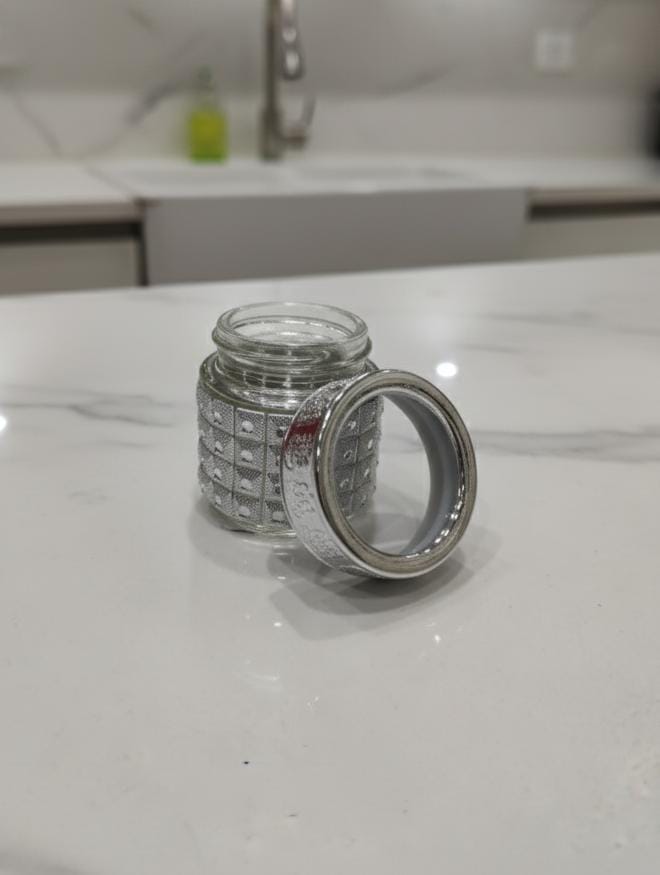 AKDC Decorative Glass Bottle – 6×5 cm Compact Silver Finish Bottle, Ideal for Storage or Home Décor Accent - Al Kabayel Discount CentreAKDC Decorative Glass Bottle – 6×5 cm Compact Silver Finish Bottle, Ideal for Storage or Home Décor AccentJars & Food SaversAKDCAl Kabayel Discount Centre