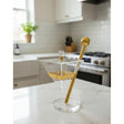 AKDC Designer Glass Candy Pot with Gold Metal Holder – Unique Decorative Serving Bowl for Sweets, Snacks, or Home Decor 28x14 cm - Al Kabayel Discount CentreAKDC Designer Glass Candy Pot with Gold Metal Holder – Unique Decorative Serving Bowl for Sweets, Snacks, or Home Decor 28x14 cmJars & Food SaversAKDCAl Kabayel Discount Centre