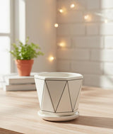 AKDC Designer White Ceramic Pot with Black Geometric Triangle Line Pattern – 15×17 cm - Al Kabayel Discount CentreAKDC Designer White Ceramic Pot with Black Geometric Triangle Line Pattern – 15×17 cmFlower/Plant PotsAKDCAl Kabayel Discount Centre