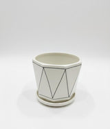 AKDC Designer White Ceramic Pot with Black Geometric Triangle Line Pattern – 15×17 cm - Al Kabayel Discount CentreAKDC Designer White Ceramic Pot with Black Geometric Triangle Line Pattern – 15×17 cmFlower/Plant PotsAKDCAl Kabayel Discount Centre
