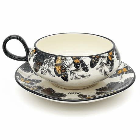 AKDC Elegant White Ceramic Cup & Saucer Set with Artistic Black Butterfly Design, Decorative Drinkware 200ml - Al Kabayel Discount CentreAKDC Elegant White Ceramic Cup & Saucer Set with Artistic Black Butterfly Design, Decorative Drinkware 200mlTea CupsAKDCAl Kabayel Discount Centre