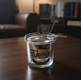 AKDC Glass Ashtray with Steel Top – Modern Round Design Featuring Stylish Man Smoking Logo, Elegant Tabletop Piece - Al Kabayel Discount CentreAKDC Glass Ashtray with Steel Top – Modern Round Design Featuring Stylish Man Smoking Logo, Elegant Tabletop PieceHome Décor AccentsAKDCAl Kabayel Discount Centre