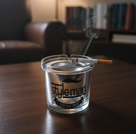 AKDC Glass Ashtray with Steel Top – Modern Round Design Featuring Stylish Man Smoking Logo, Elegant Tabletop Piece - Al Kabayel Discount CentreAKDC Glass Ashtray with Steel Top – Modern Round Design Featuring Stylish Man Smoking Logo, Elegant Tabletop PieceHome Décor AccentsAKDCAl Kabayel Discount Centre