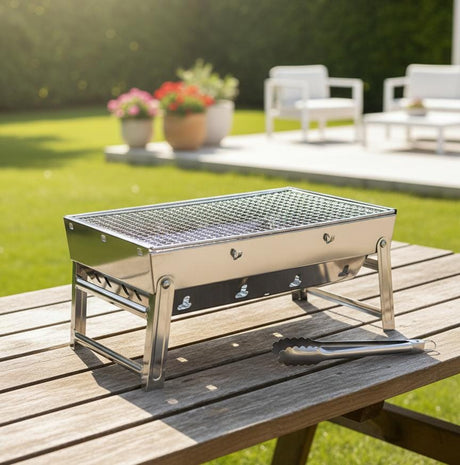 AKDC Mini BBQ Grill 360×68×290 mm | 2.5 kg Silver Color Portable Tabletop Barbecue | Compact Outdoor Charcoal Grill for Camping & Travel - Al Kabayel Discount CentreAKDC Mini BBQ Grill 360×68×290 mm | 2.5 kg Silver Color Portable Tabletop Barbecue | Compact Outdoor Charcoal Grill for Camping & TravelBBQ Grills & Fire PitsAKDCAl Kabayel Discount Centre