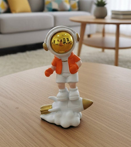 AKDC Mini Ceramic Astronaut Balancing on White & Orange Spaceship Figurine – Creative Space Décor 7.5 cm - Al Kabayel Discount CentreAKDC Mini Ceramic Astronaut Balancing on White & Orange Spaceship Figurine – Creative Space Décor 7.5 cmHome Décor AccentsAKDCAl Kabayel Discount Centre