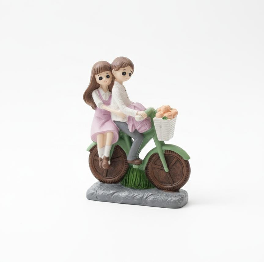 AKDC Polyresin Romantic Couple on Bicycle Figurine – Green & Pink Decorative Love Sculpture 12 cm - Al Kabayel Discount CentreAKDC Polyresin Romantic Couple on Bicycle Figurine – Green & Pink Decorative Love Sculpture 12 cmHome Décor AccentsAKDCAl Kabayel Discount Centre