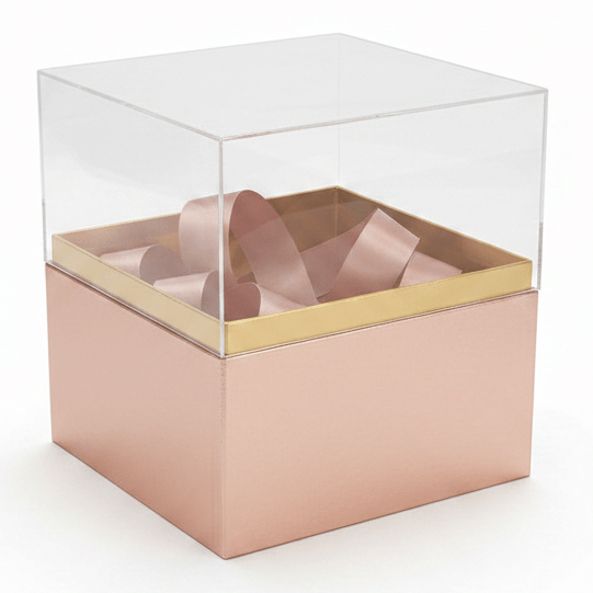 AKDC Rose Gold Square Cardboard Gift Box with Transparent Lid & Ribbon Ties for Premium Gift Packaging, Hampers & Occasions – 18×18×19 cm - Al Kabayel Discount CentreAKDC Rose Gold Square Cardboard Gift Box with Transparent Lid & Ribbon Ties for Premium Gift Packaging, Hampers & Occasions – 18×18×19 cmPacking & Wrapping SuppliesAKDCAl Kabayel Discount Centre