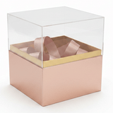AKDC Rose Gold Square Cardboard Gift Box with Transparent Lid & Ribbon Ties for Premium Gift Packaging, Hampers & Occasions – 18×18×19 cm - Al Kabayel Discount CentreAKDC Rose Gold Square Cardboard Gift Box with Transparent Lid & Ribbon Ties for Premium Gift Packaging, Hampers & Occasions – 18×18×19 cmPacking & Wrapping SuppliesAKDCAl Kabayel Discount Centre