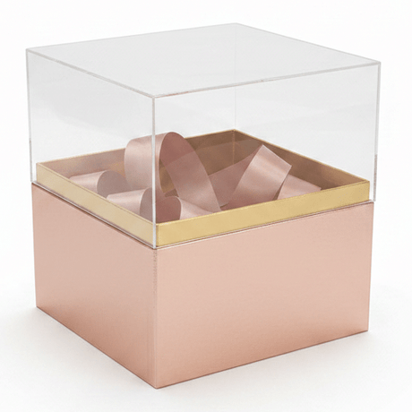 AKDC Rose Gold Square Cardboard Gift Box with Transparent Lid & Ribbon Ties for Premium Gift Packaging, Hampers & Occasions – 18×18×19 cm - Al Kabayel Discount CentreAKDC Rose Gold Square Cardboard Gift Box with Transparent Lid & Ribbon Ties for Premium Gift Packaging, Hampers & Occasions – 18×18×19 cmPacking & Wrapping SuppliesAKDCAl Kabayel Discount Centre