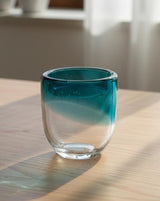 AKDC Transparent Glass Vase with Soft Blue Tint – Artistic Round Shape – 18×16 cm - Al Kabayel Discount CentreAKDC Transparent Glass Vase with Soft Blue Tint – Artistic Round Shape – 18×16 cmFlower/Plant PotsAKDCAl Kabayel Discount Centre