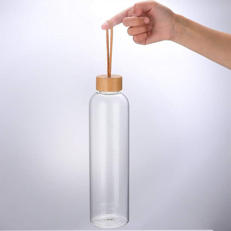 AKDC Transparent Glass Water Bottle 1000ml with a Wooden Lid - Al Kabayel Discount CentreAKDC Transparent Glass Water Bottle 1000ml with a Wooden LidWater BottlesAKDCAl Kabayel Discount Centre