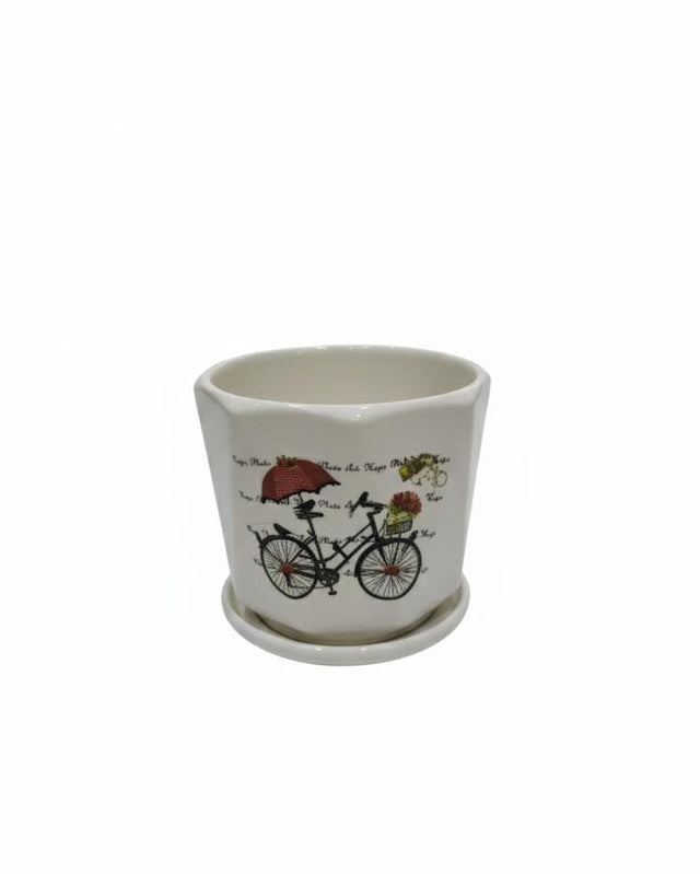 AKDC White Ceramic Pot with Cycle Artwork Design – 12×13 cm - Al Kabayel Discount CentreAKDC White Ceramic Pot with Cycle Artwork Design – 12×13 cmFlower/Plant PotsAKDCAl Kabayel Discount Centre