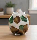 AKDC White Glass Vase with Green & Brown Artistic Accents – Designer Decorative Piece – 21×20 cm - Al Kabayel Discount CentreAKDC White Glass Vase with Green & Brown Artistic Accents – Designer Decorative Piece – 21×20 cmFlower/Plant PotsAKDCAl Kabayel Discount Centre