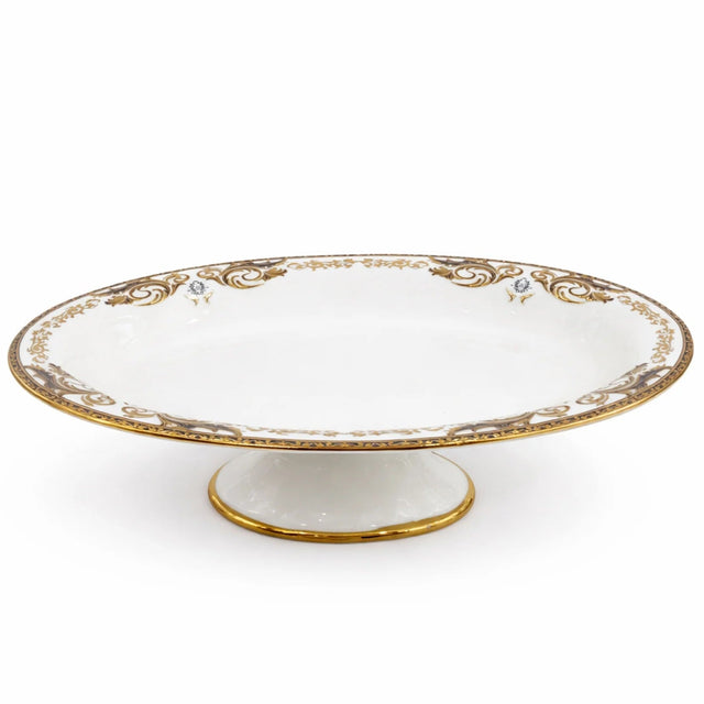 Angela AB - 146 Ceramic Oval Pedestal Bowl with Stand – 33 × 20 cm – White with Gold Detailing - Al Kabayel Discount CentreAngela AB - 146 Ceramic Oval Pedestal Bowl with Stand – 33 × 20 cm – White with Gold DetailingServing TraysANGELAAl Kabayel Discount Centre