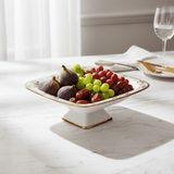 Angela AB - 150 Ceramic Square Pedestal Bowl with Stand – 31 × 22 cm – White with Gold Detailing - Al Kabayel Discount CentreAngela AB - 150 Ceramic Square Pedestal Bowl with Stand – 31 × 22 cm – White with Gold DetailingServing TraysANGELAAl Kabayel Discount Centre
