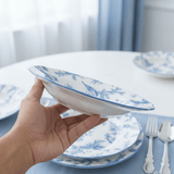 Angela White Ceramic Round Soup Plate with Blue Tree & Bird Design - 22 cm - Al Kabayel Discount CentreAngela White Ceramic Round Soup Plate with Blue Tree & Bird Design - 22 cmPlatesANGELAAl Kabayel Discount Centre