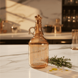 Herevin Tinted Orange Glass Oil Bottle – 1 Litre | Elegant Etched Design with Handle - Al Kabayel Discount CentreHerevin Tinted Orange Glass Oil Bottle – 1 Litre | Elegant Etched Design with HandleKitchen Utensils & GadgetsHEREVINAl Kabayel Discount Centre