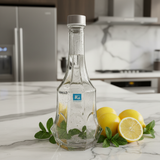 Pishgaman Elegant Faceted Clear Glass Water Bottle 1500ml – Premium Hexagonal Design with Secure Silver Metal Cap