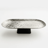 Luhpar Wave Textured Aluminium Oval Pedestal Dish with Black Wooden Base - 50×18×13cm - 74894-B - Al Kabayel Discount CentreLuhpar Wave Textured Aluminium Oval Pedestal Dish with Black Wooden Base - 50×18×13cm - 74894-BServing TraysLUHPARAl Kabayel Discount Centre