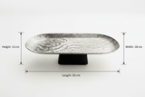 Luhpar Wave Textured Aluminium Oval Pedestal Dish with Black Wooden Base - 50×18×13cm - 74894-B - Al Kabayel Discount CentreLuhpar Wave Textured Aluminium Oval Pedestal Dish with Black Wooden Base - 50×18×13cm - 74894-BServing TraysLUHPARAl Kabayel Discount Centre