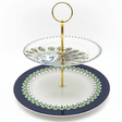  "Elegant two-tiered peacock serving stand with navy blue and white porcelain plates and gold metal stand on white background"