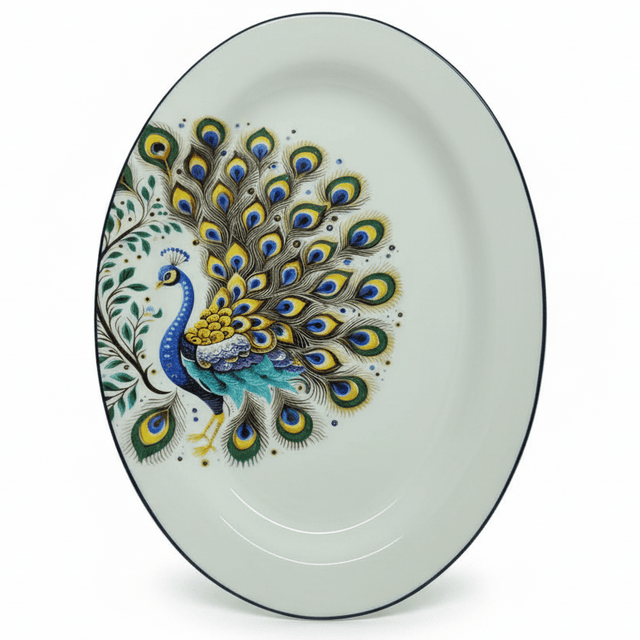 "Elegant oval serving platter with intricate peacock design featuring blue, green, and gold feather motifs on white porcelain with blue rim"