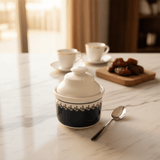Luhpar White Ceramic Sugar Jar with Elegant Navy Blue Pattern and Lid for Kitchen and Dining Use – 10 cm - Al Kabayel Discount CentreLuhpar White Ceramic Sugar Jar with Elegant Navy Blue Pattern and Lid for Kitchen and Dining Use – 10 cmJars & Food SaversLUHPARAl Kabayel Discount Centre