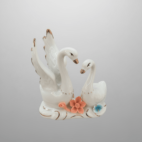 Luxury White Ceramic Swan Table Décor with Multicolour Floral Artwork for Home Decoration – 12×14cm - Al Kabayel Discount CentreLuxury White Ceramic Swan Table Décor with Multicolour Floral Artwork for Home Decoration – 12×14cmHome Décor AccentsAKDCAl Kabayel Discount Centre