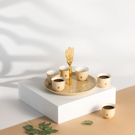 Otantic Naqsh 7pcs Porcelain Arabic Coffee Set, 6pcs Cups 80ml +1pc Standwith Handle, Ivory/Gold, ET2967 - Al Kabayel Discount CentreOtantic Naqsh 7pcs Porcelain Arabic Coffee Set, 6pcs Cups 80ml +1pc Standwith Handle, Ivory/Gold, ET2967Tea SetsOTANTIKAl Kabayel Discount Centre