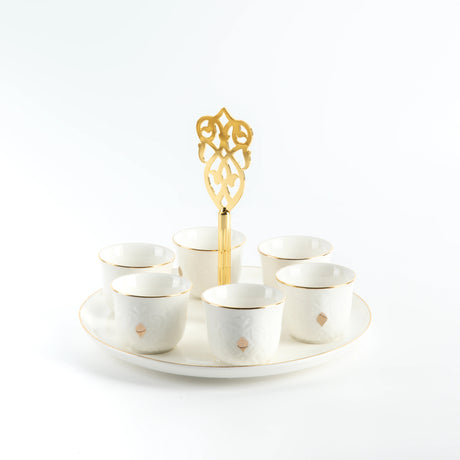 Otantic Naqsh 7pcs Porcelain Arabic Coffee Set, 6pcs Cups 80ml +1pc Standwith Handle, White/Gold, ET2965 - Al Kabayel Discount CentreOtantic Naqsh 7pcs Porcelain Arabic Coffee Set, 6pcs Cups 80ml +1pc Standwith Handle, White/Gold, ET2965Tea SetsOTANTIKAl Kabayel Discount Centre