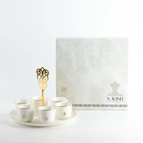 Otantic Naqsh 7pcs Porcelain Arabic Coffee Set, 6pcs Cups 80ml +1pc Standwith Handle, White/Gold, ET2965 - Al Kabayel Discount CentreOtantic Naqsh 7pcs Porcelain Arabic Coffee Set, 6pcs Cups 80ml +1pc Standwith Handle, White/Gold, ET2965Tea SetsOTANTIKAl Kabayel Discount Centre