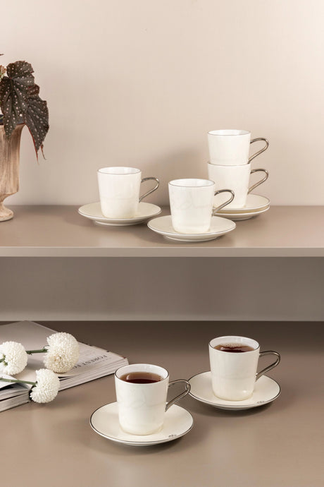 Otantik Mirral Premium 12 - Piece Porcelain Tea Cup & Saucer Set – White with Silver Accent 240CC - Al Kabayel Discount CentreOtantik Mirral Premium 12 - Piece Porcelain Tea Cup & Saucer Set – White with Silver Accent 240CCTea SetsOTANTIKAl Kabayel Discount Centre