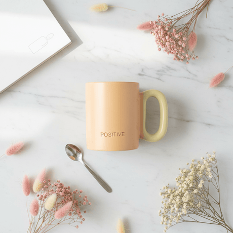 POSITIVE Matte Peach Ceramic Mug | 300ml | Yellow Handle - Al Kabayel Discount CentrePOSITIVE Matte Peach Ceramic Mug | 300ml | Yellow HandleMugsAKDCAl Kabayel Discount Centre