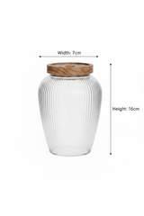 Ribbed Glass Jar with Wooden Lid – 16x7 cm - Al Kabayel Discount CentreRibbed Glass Jar with Wooden Lid – 16x7 cmJars & Food SaversAKDCAl Kabayel Discount Centre