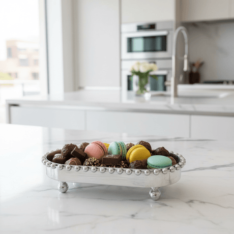 Silver Metal Oval Candy & Sweets Serving Tray with Beaded Pearl Border and Ball Feet — 20×10 cm - Al Kabayel Discount CentreSilver Metal Oval Candy & Sweets Serving Tray with Beaded Pearl Border and Ball Feet — 20×10 cmServing TraysAKDCAl Kabayel Discount Centre