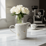 White Ceramic Creamer Jug with Gold Accent Design and Easy - Pour Handle – Stylish Milk Server (10×6 cm) - Al Kabayel Discount CentreWhite Ceramic Creamer Jug with Gold Accent Design and Easy - Pour Handle – Stylish Milk Server (10×6 cm)Jars & Food SaversAKDCAl Kabayel Discount Centre
