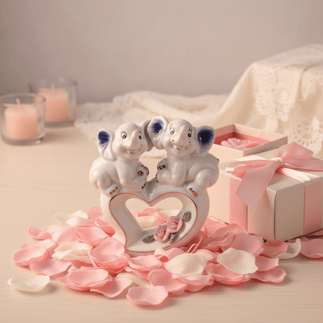 White Ceramic Elephant Couple Figurine – Heart & Rose Décor Piece, 13cm - Al Kabayel Discount CentreWhite Ceramic Elephant Couple Figurine – Heart & Rose Décor Piece, 13cmHome Décor AccentsAKDCAl Kabayel Discount Centre